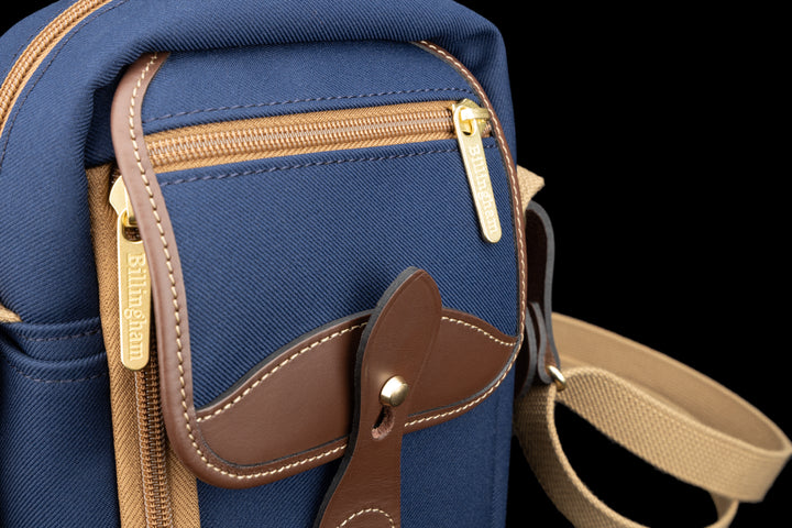 Airline Stowaway Navy FibreNyte Chocolate Leather Close Up