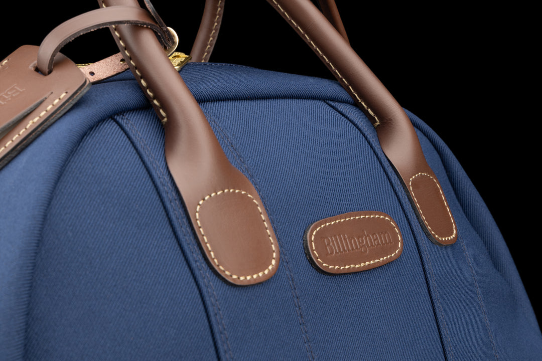 Overnighter Navy FibreNyte Chocolate Leather Close Up