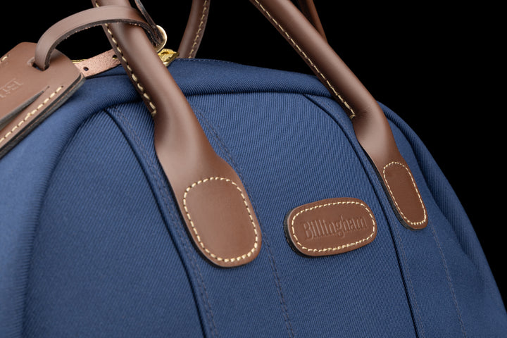 Overnighter Navy FibreNyte Chocolate Leather Close Up